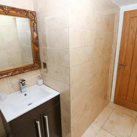 The Warren Barn Casa de Férias